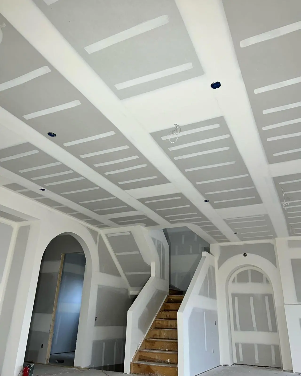 Drywall Taping Across a Two-Story Home